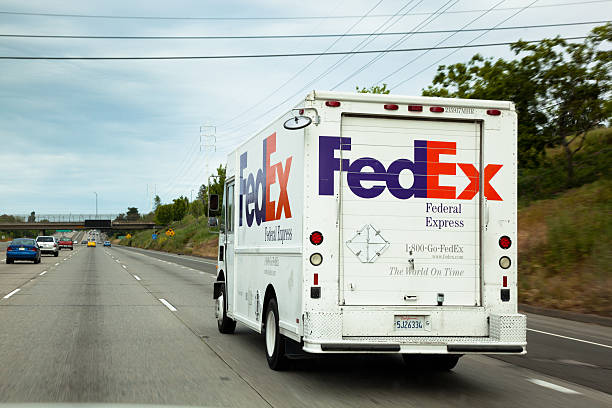 Sacramento, California, USA - April 23, 2011: FedEx truck on I-50 freeway in Sacramento county. FedEx Corporation is an global courier delivery services company most famous for express shipping.